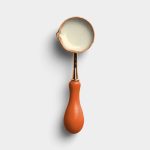 Tangerine Wax Melting Spoon with Wax 01 PNG Image Thumbnail.jpg
